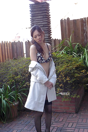 Misaki Yoshimura is posing in her garden with a sexy lingerie